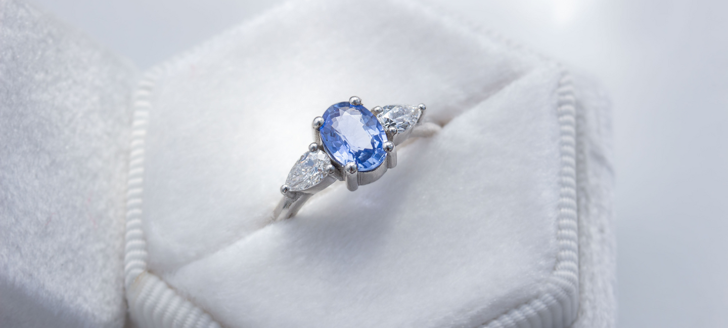 Oval Ceylon Sapphire with pear diamonds triple 2 stone engagement ring in platinum