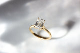 Emerald cut diamond solitaire engagement ring